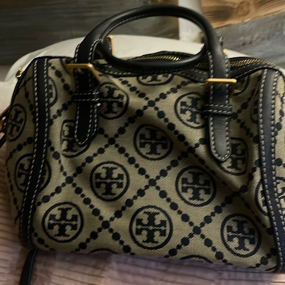 Tory Burch navy blue and tan in color purse with a long shoulder strap /